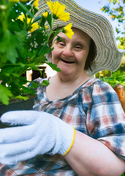 woman with special needs doing some gardening