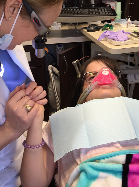 woman undergoing dental sedation